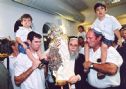Avital's father carrying the Torah, on his sides the grandchildren who were left orphins